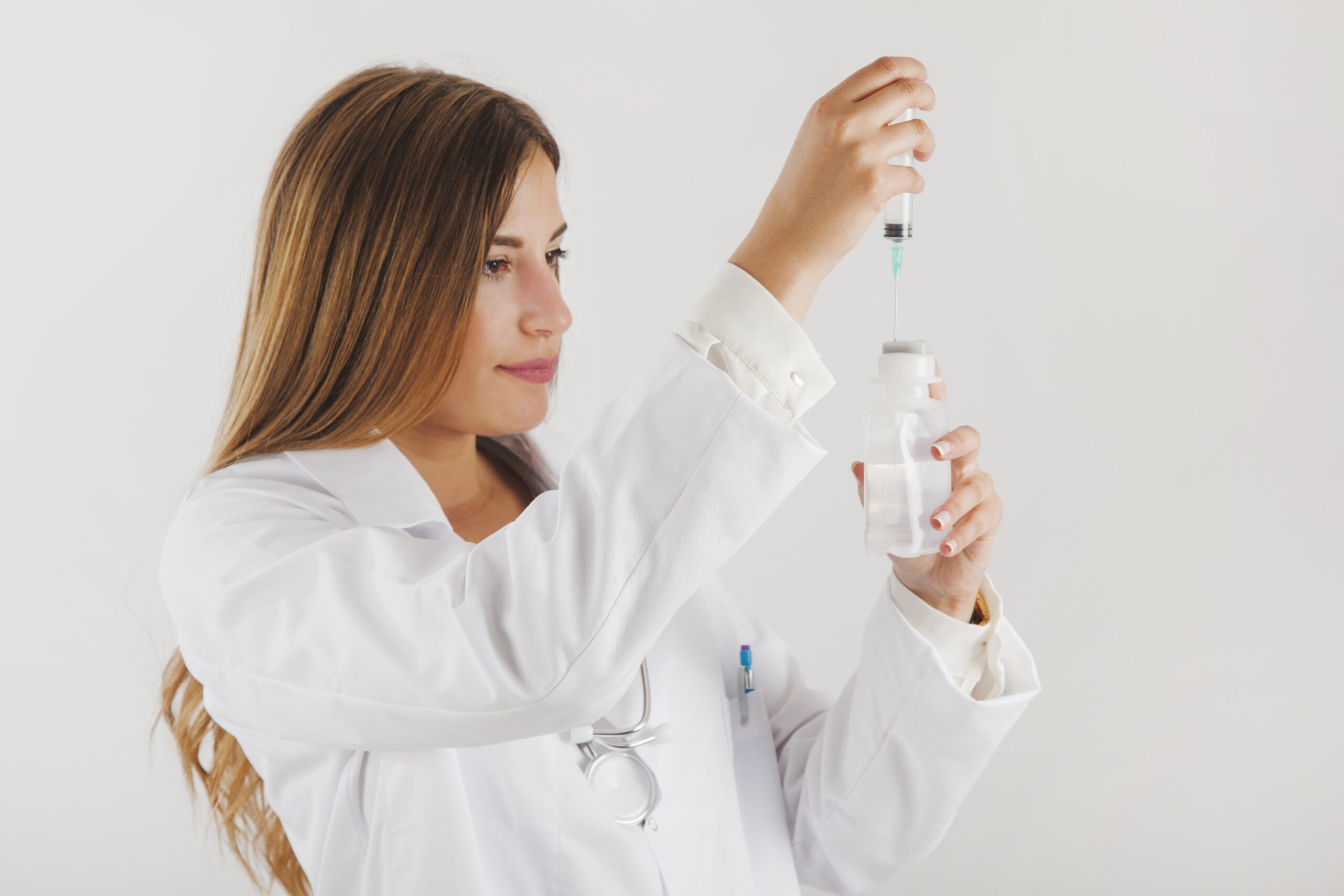 Healthcare professional preparing an intravenous medicine